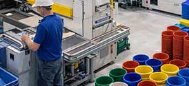 plastics and polymer manufacturing facility, organizing plastic rolls for shipping.