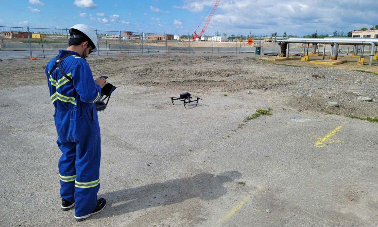 Scentroid operator launching a DR2000 drone for airborne mercury sampling at an industrial site