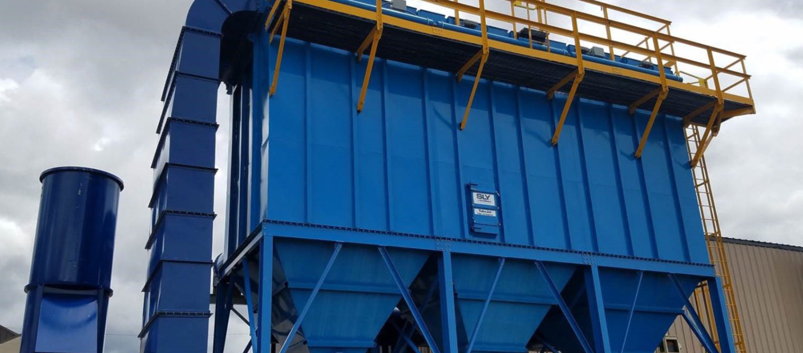 Industrial dust collector baghouse used to capture particulate at a gypsum plant